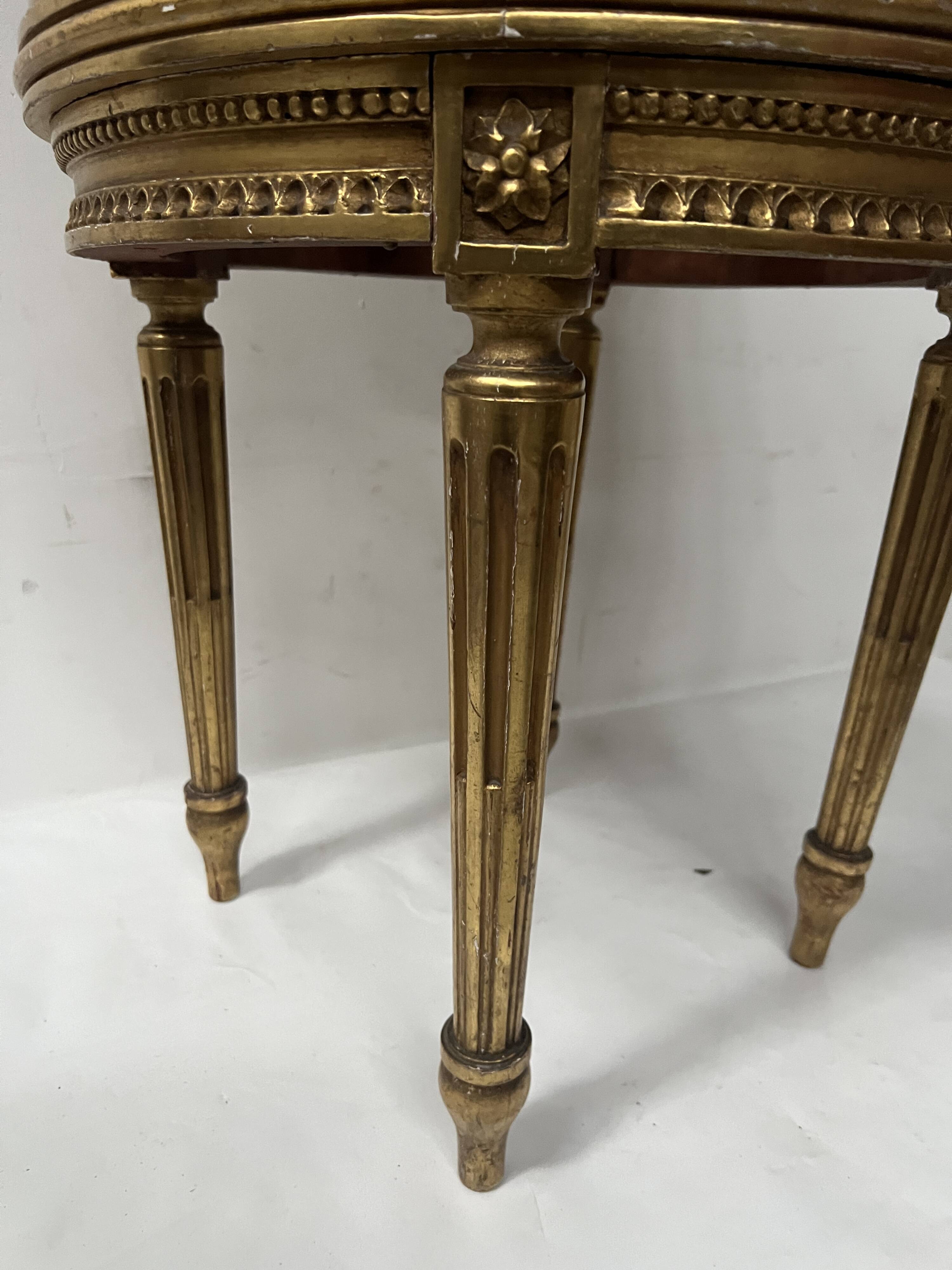 Louis XVI style armchair in wood and gilded stucco, 20th century.