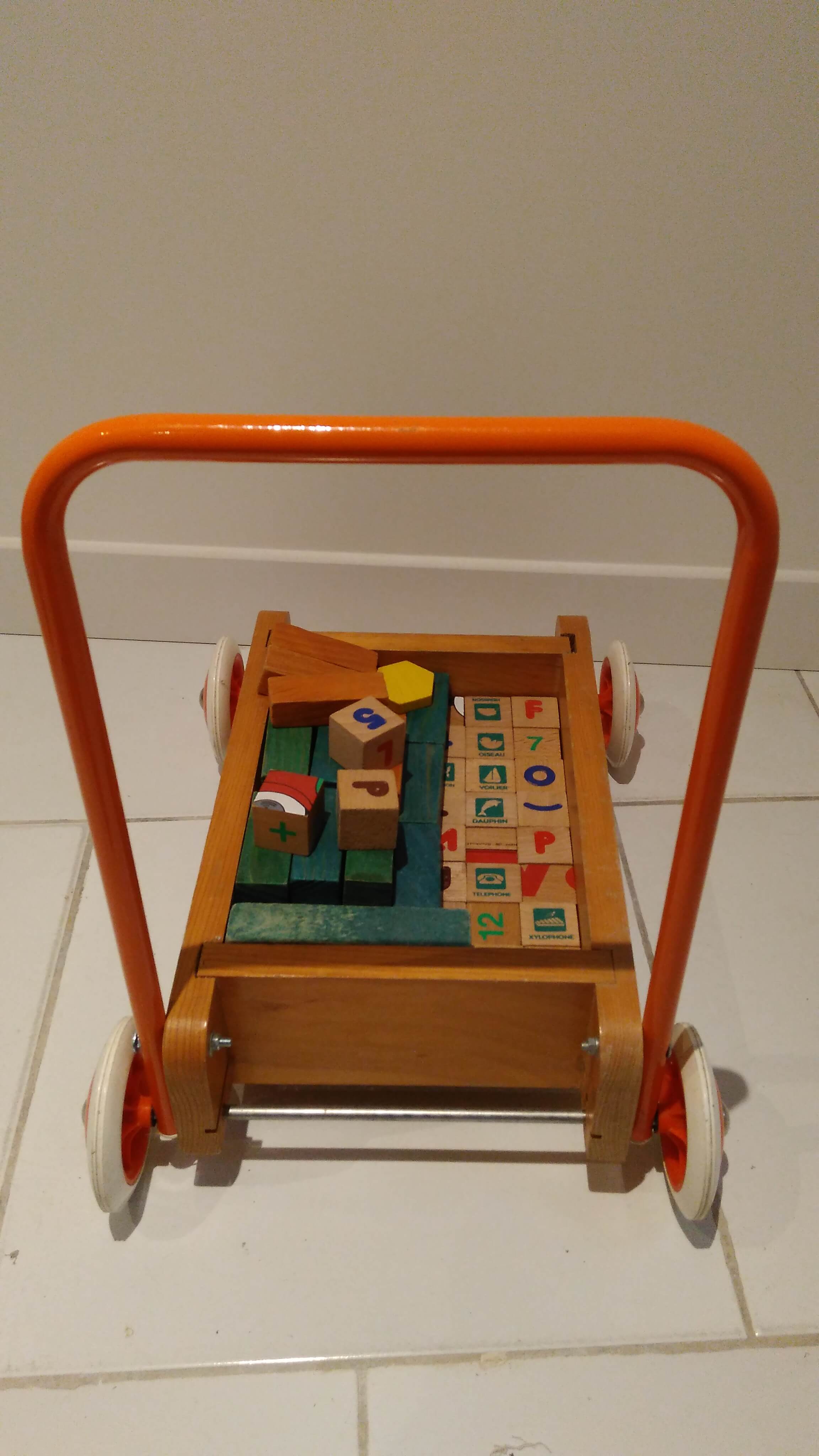 Educational game wood cubes on wheeled cart