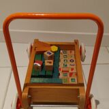 Educational game wood cubes on wheeled cart