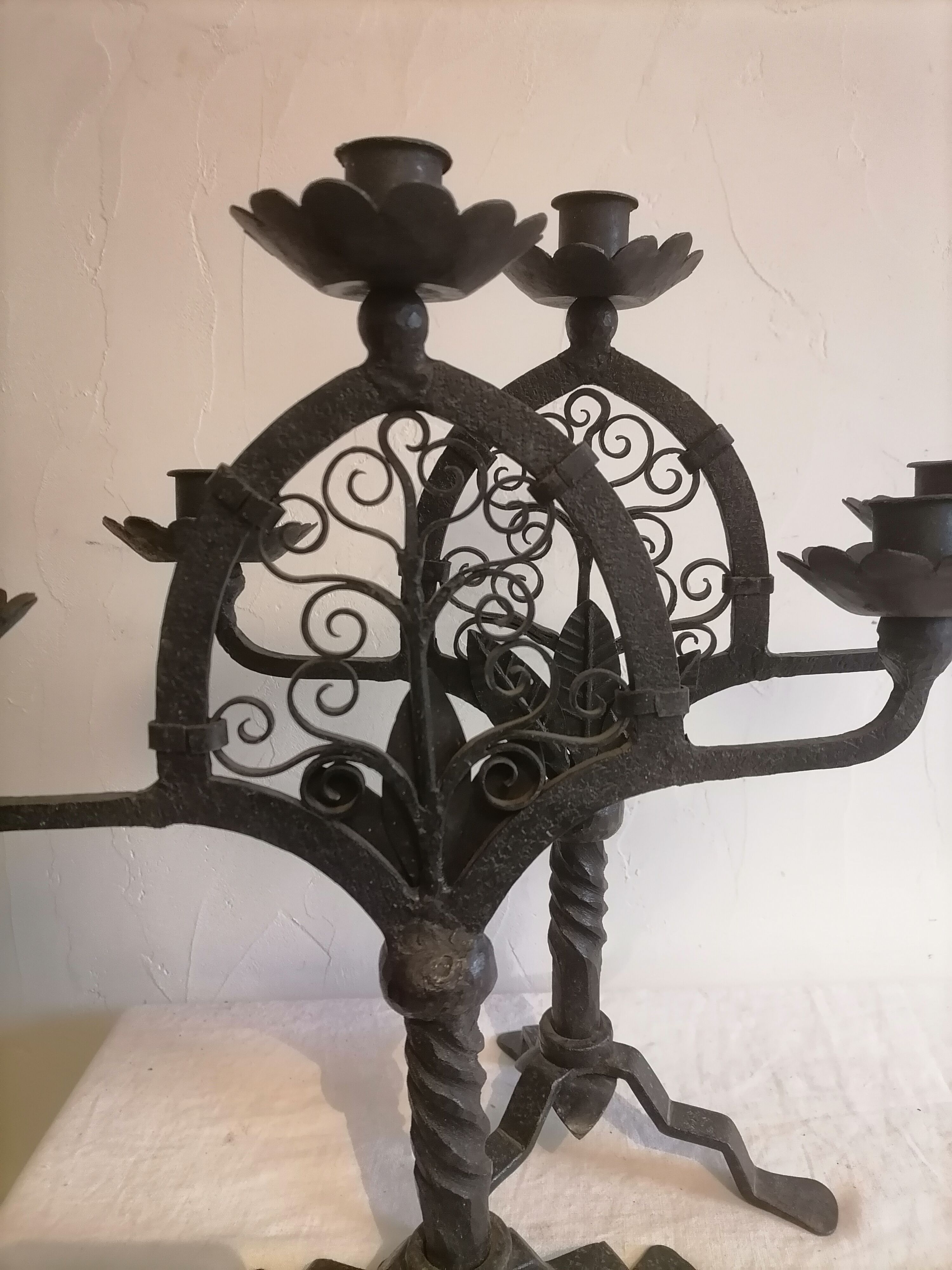 Pair of wrought iron candelabras. Mid-twentieth century.