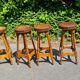 4 old leather and wood stools