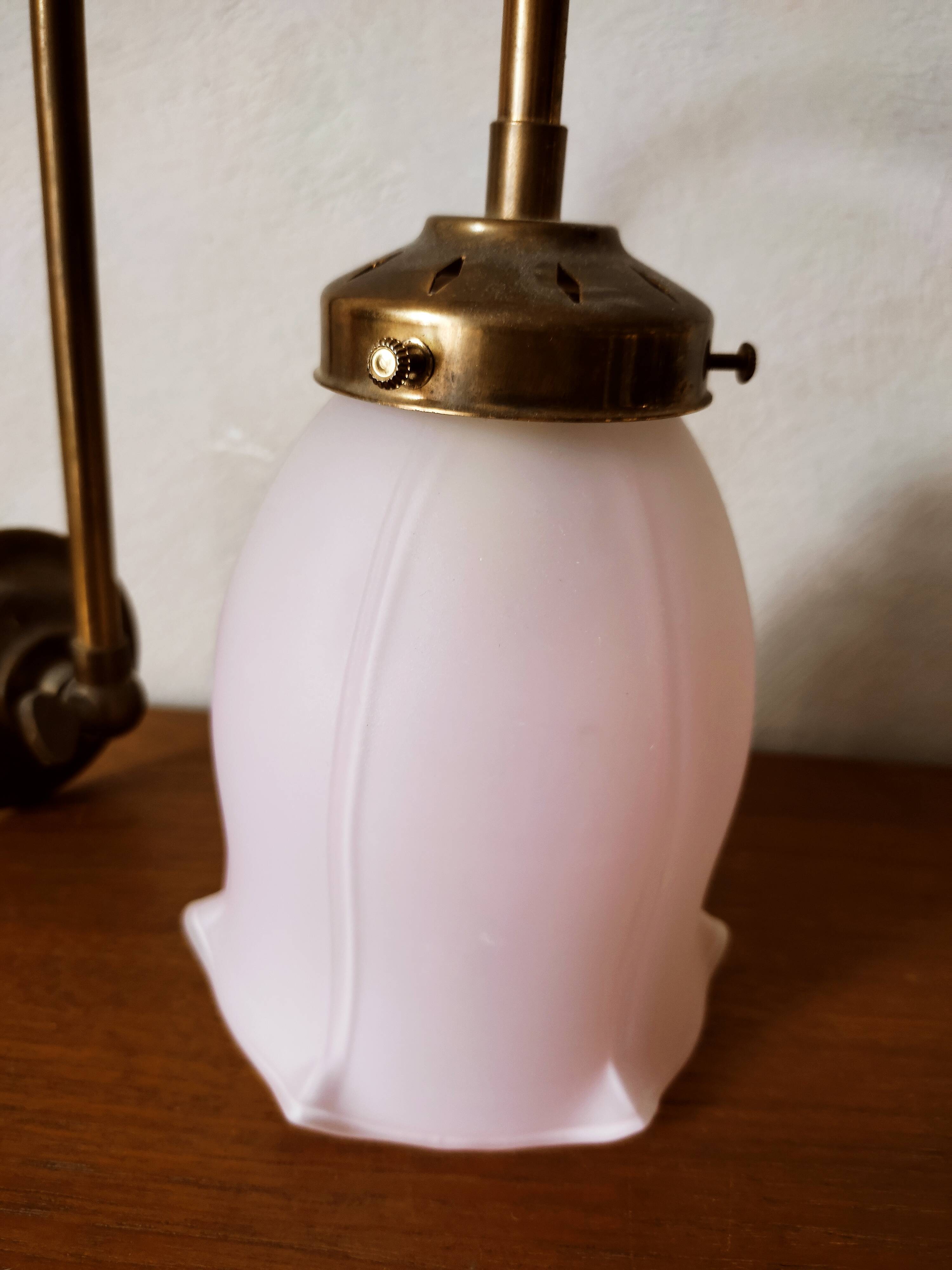 Brass wall lamp with pale pink bell