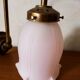 Brass wall lamp with pale pink bell