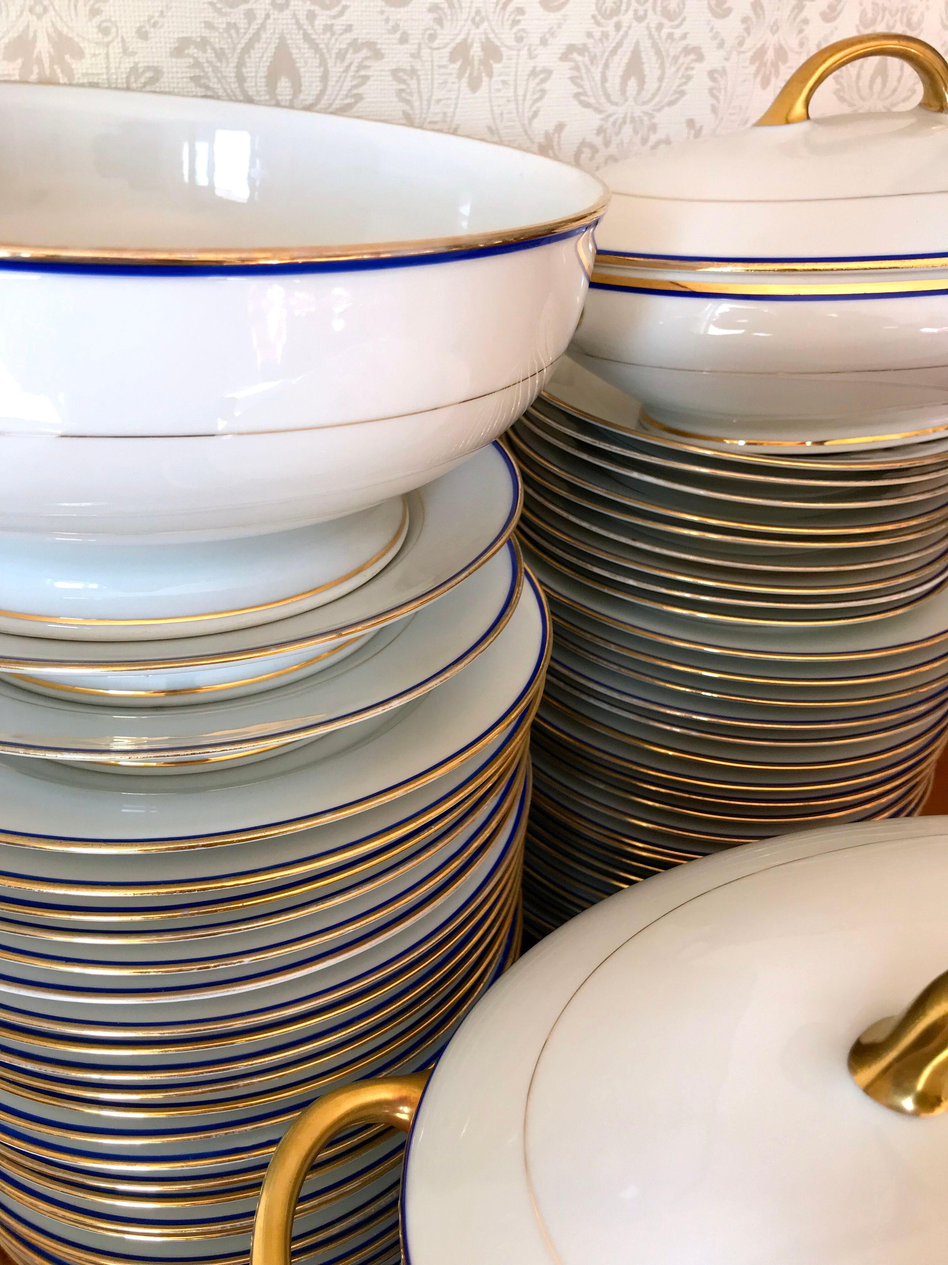 table service art deco limoges porcelain white border blue and gold 61 pieces signed