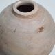 Round ceramic vase with raw finish, smoked firing, signed, late 20th century, 11 cm.