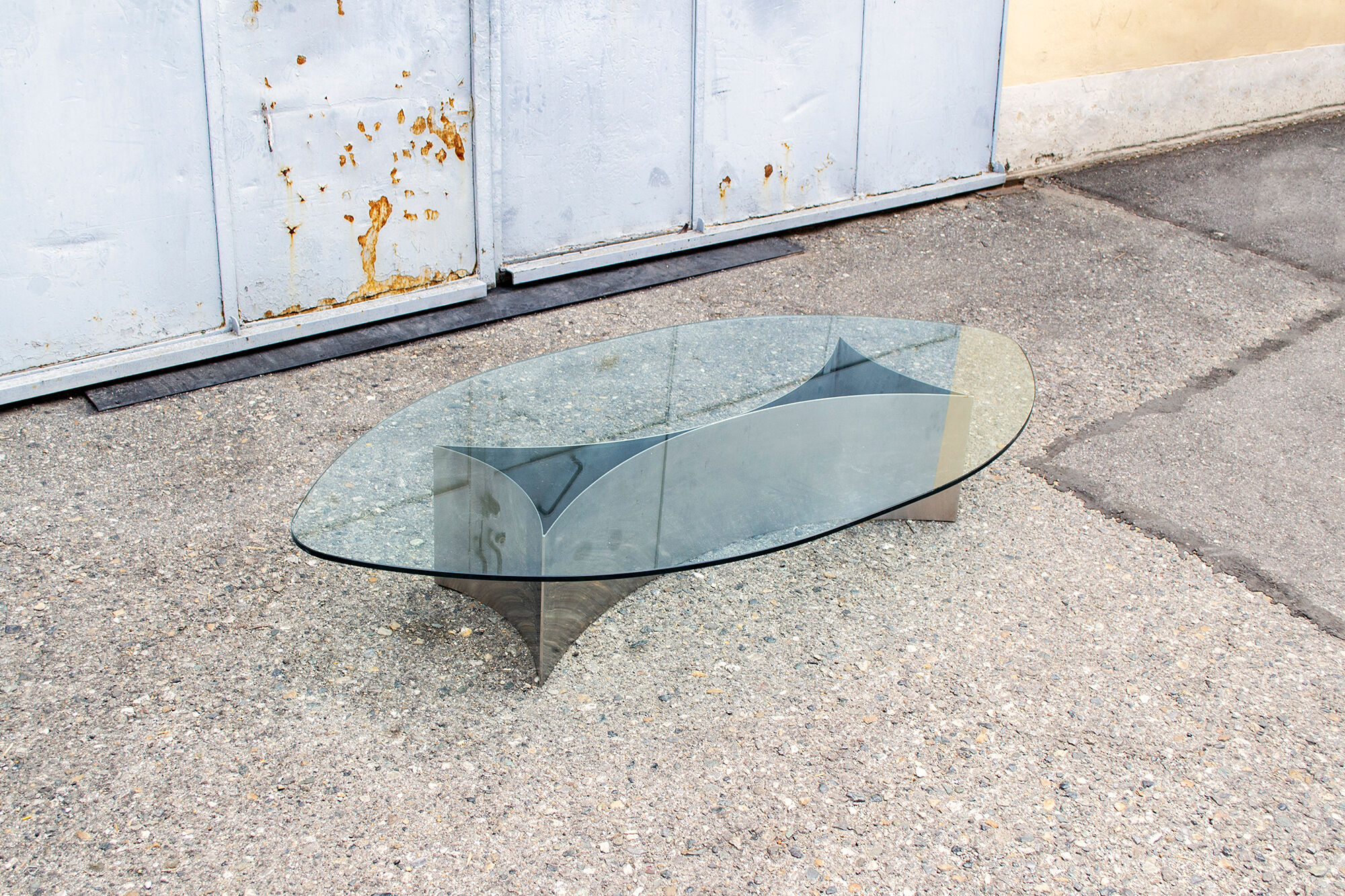 Brutalist coffee table with steel base and 70s glass top