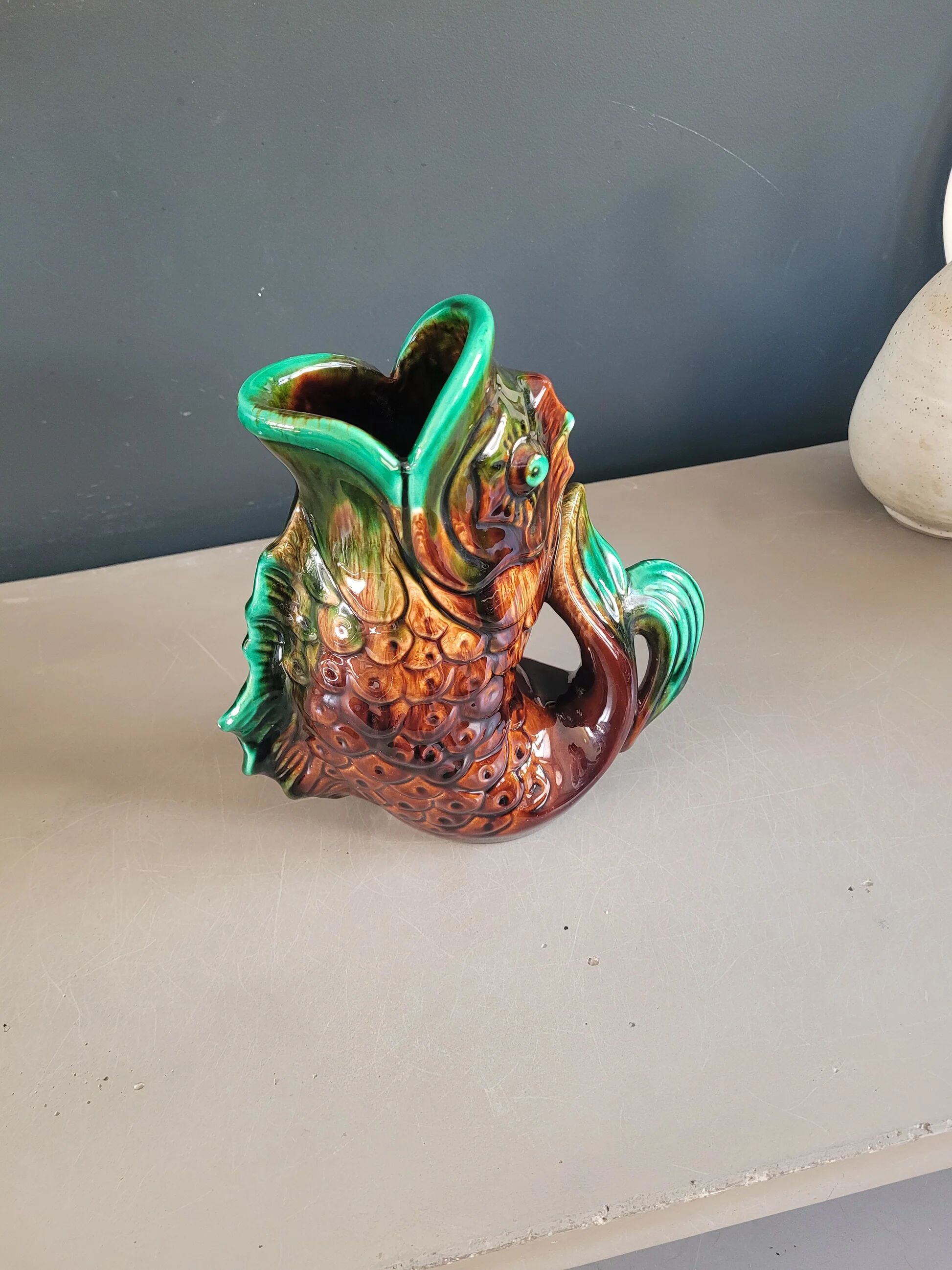 Old ceramic fish jug