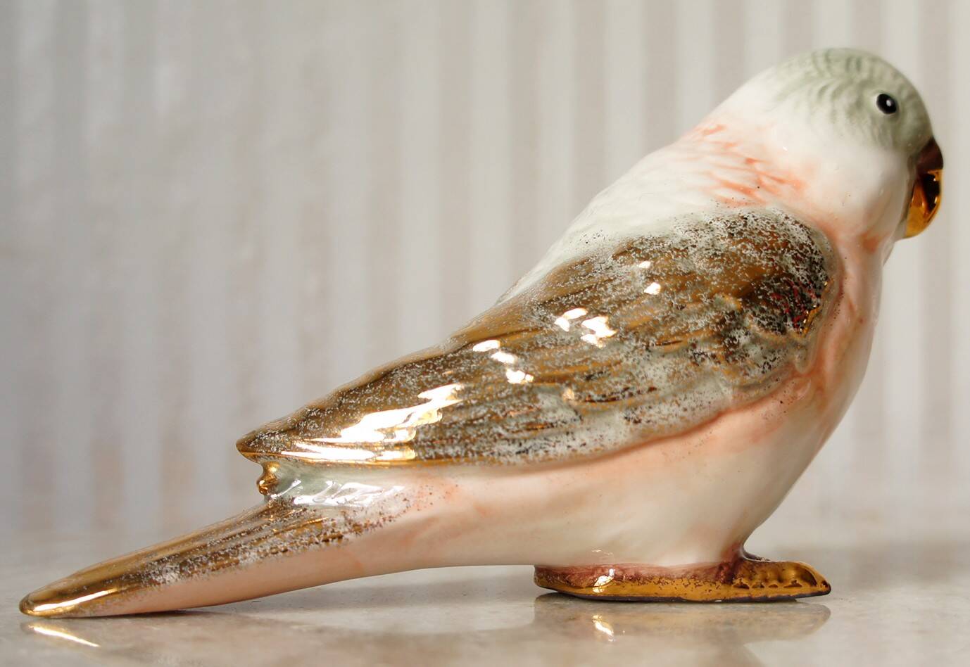 Polychrome & gold ceramic parakeet