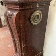 Pair of Louis XIV style fireplaces in red cherry marble. XIX century.