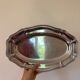 Plat en inox floral 1980