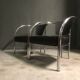 A pair of petite low armchairs by ronald cecil sportes for lumen center, 1987