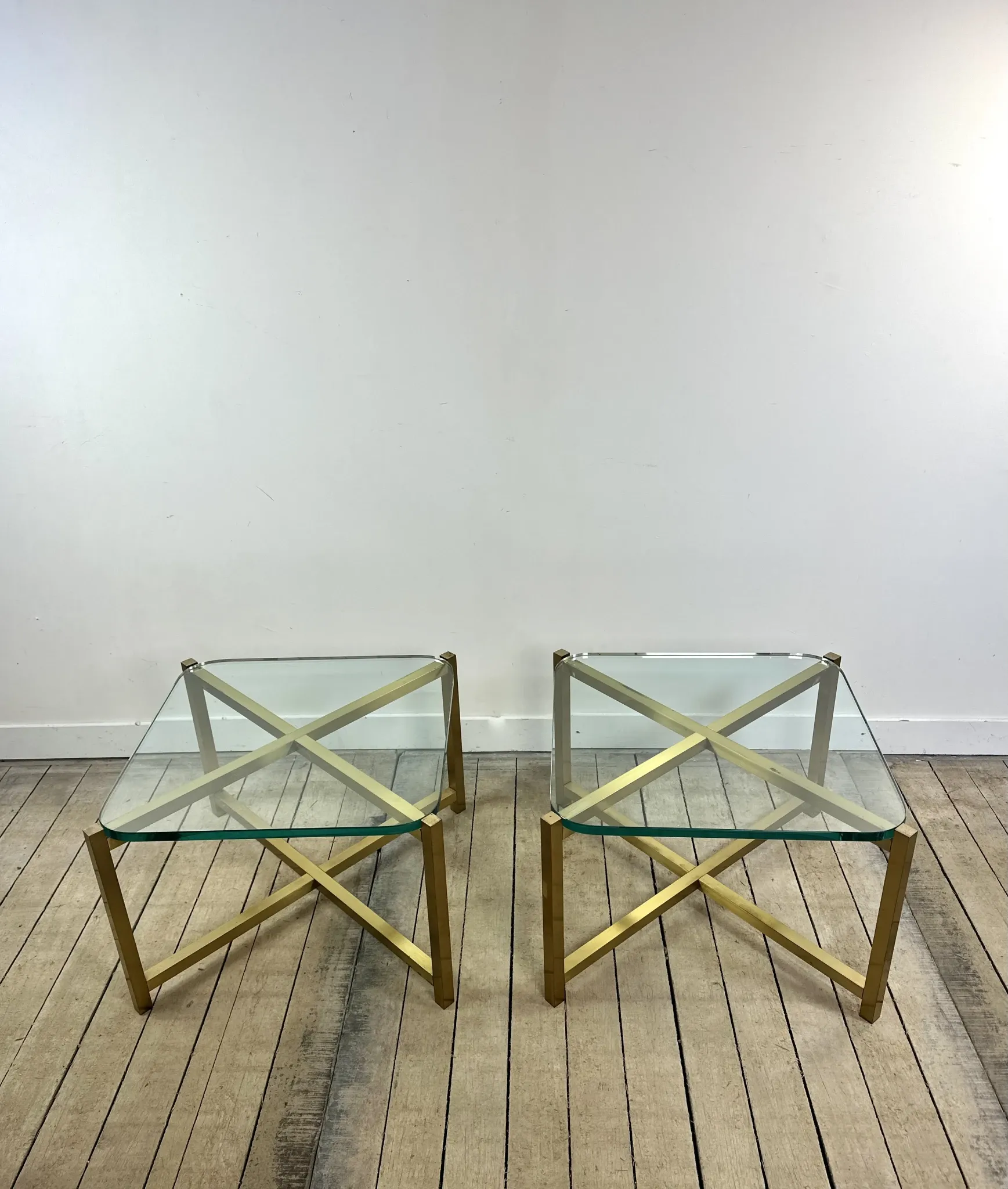 Pair of Italian brass and glass side tables from the 1970s.
