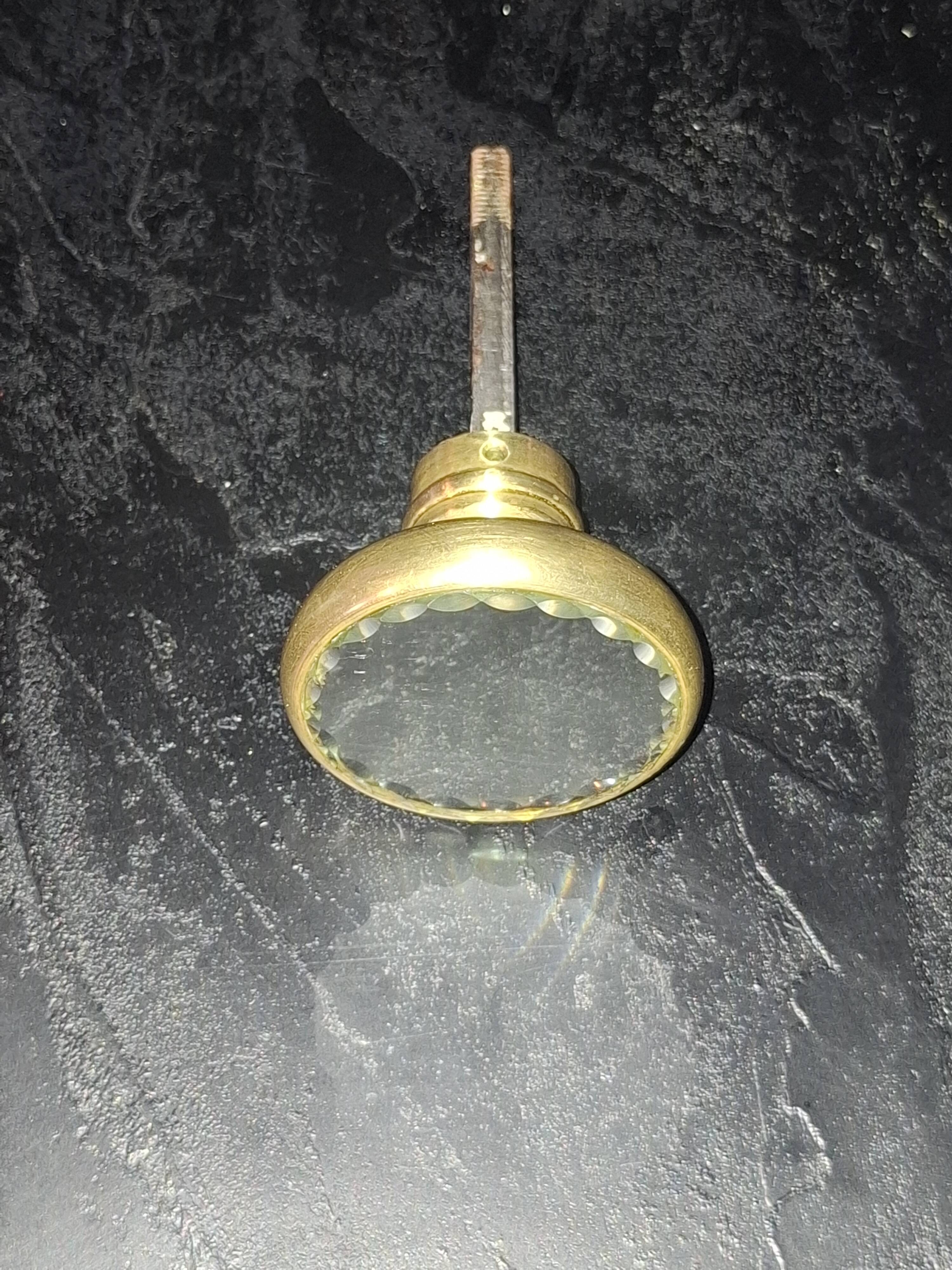 Sublime door handle made of brass with a bevelled mirror front.