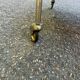Mid-Century 1978 brass and black smoked glass wheeled dessert trolley.