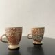 Set of 2 enamelled stoneware mugs with stylised polka dots.