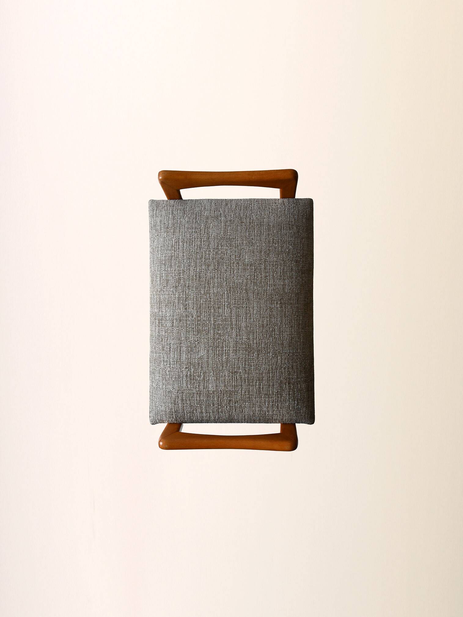 Vintage Scandinavian oak footstool with grey upholstery