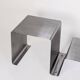 Stainless steel coffee table and stool, by the Roche Bobois design office, 1970