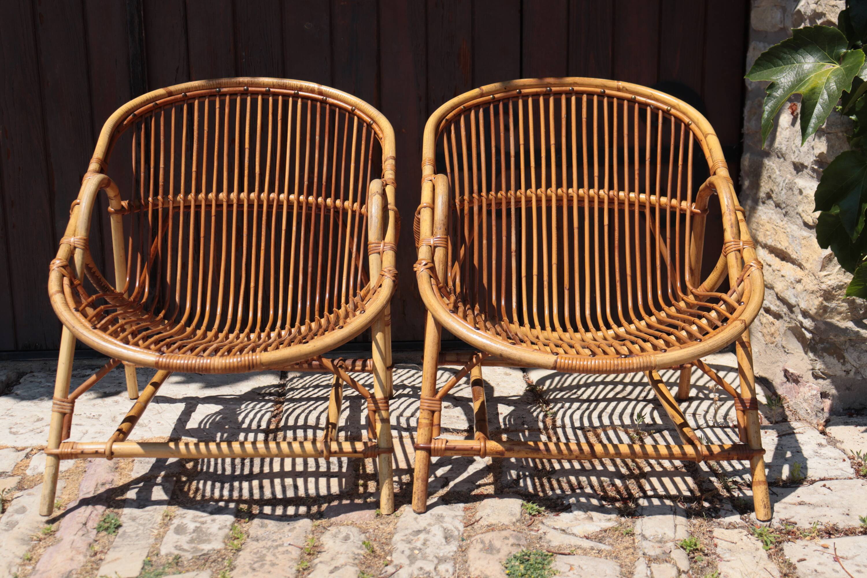 Pair of rattan armchairs Audoux-Minnet style