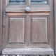 Oak entrance door and its frame and transom, wrought iron gates