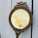 Mirror face to hand gilded bronze knot ribbon