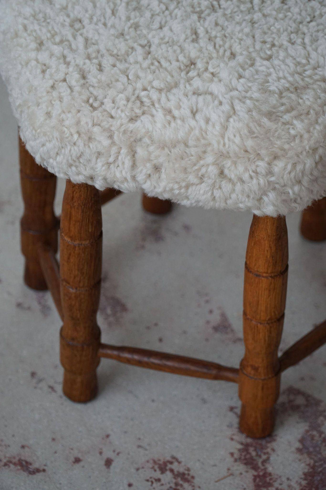 Modern Danish, a hexagonal oak stool, seat reupholstered in lambswool, 1950s.