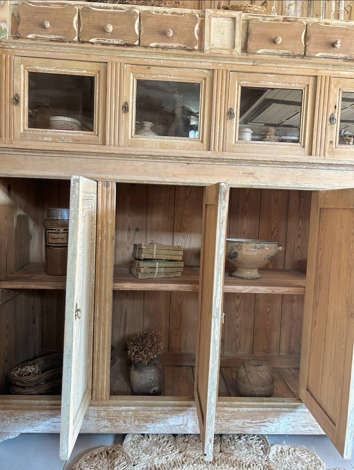 Old wooden grocery store cabinet, display cases and drawers