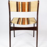 Pair of chairs in dark wood upholstered with light striped fabric of danish design