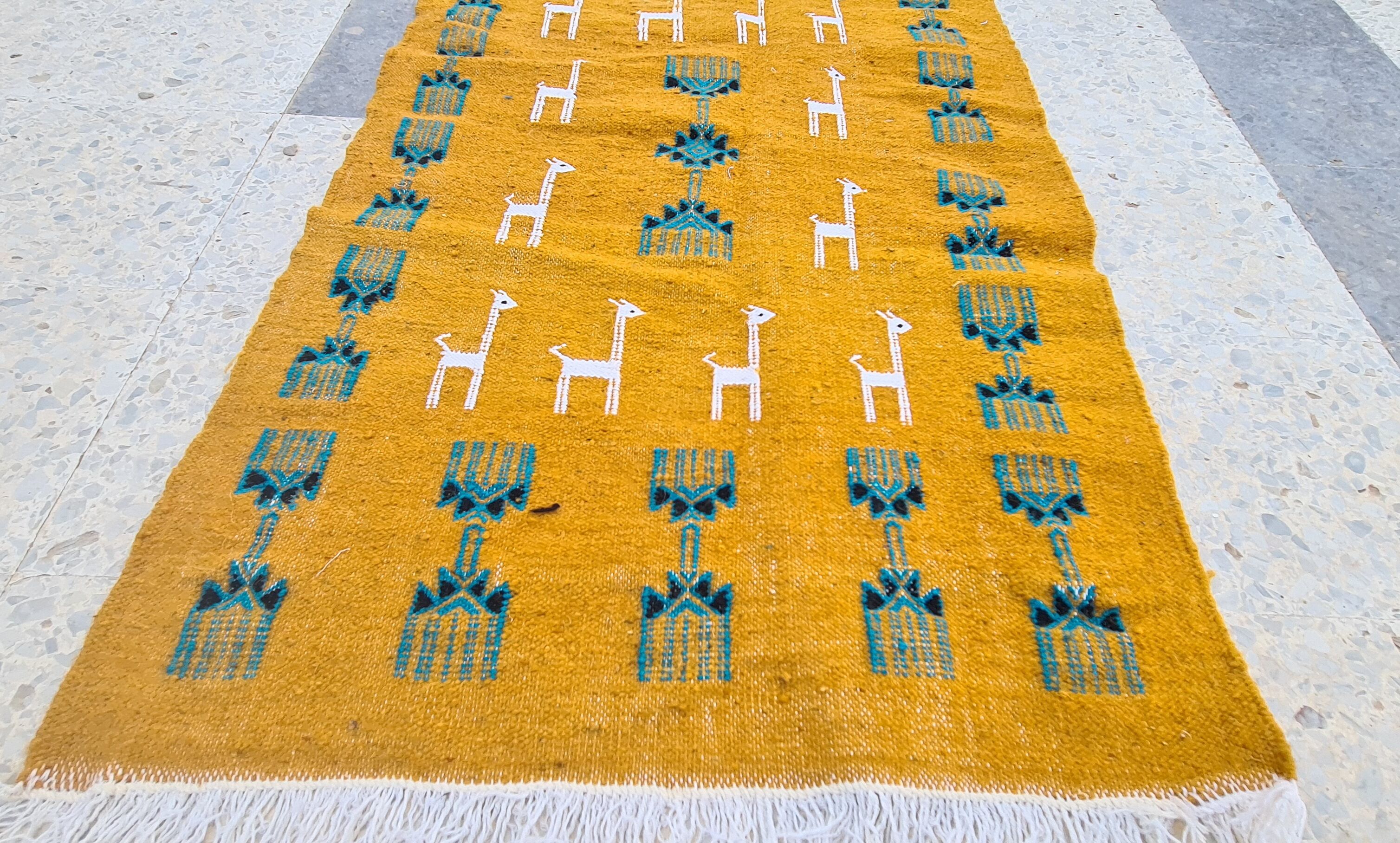 Traditional handmade gazelle-patterned carpet in pure wool