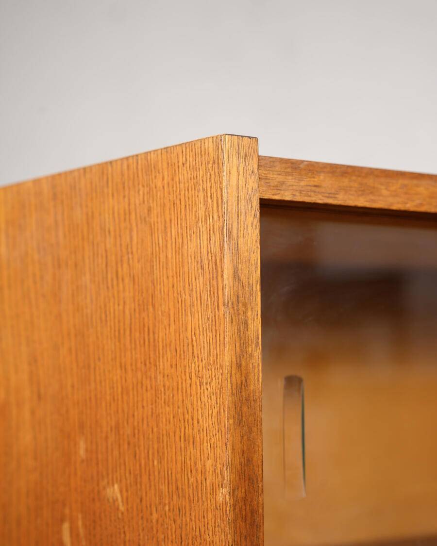 Old TV cabinet with brass handles.