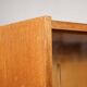 Old TV cabinet with brass handles.