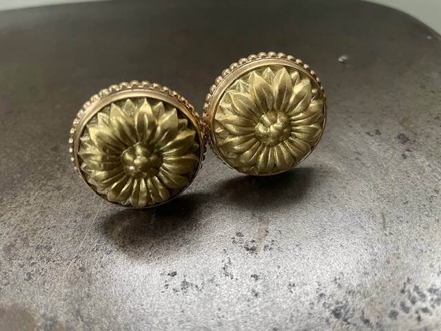 Old brass handle knobs and rosettes