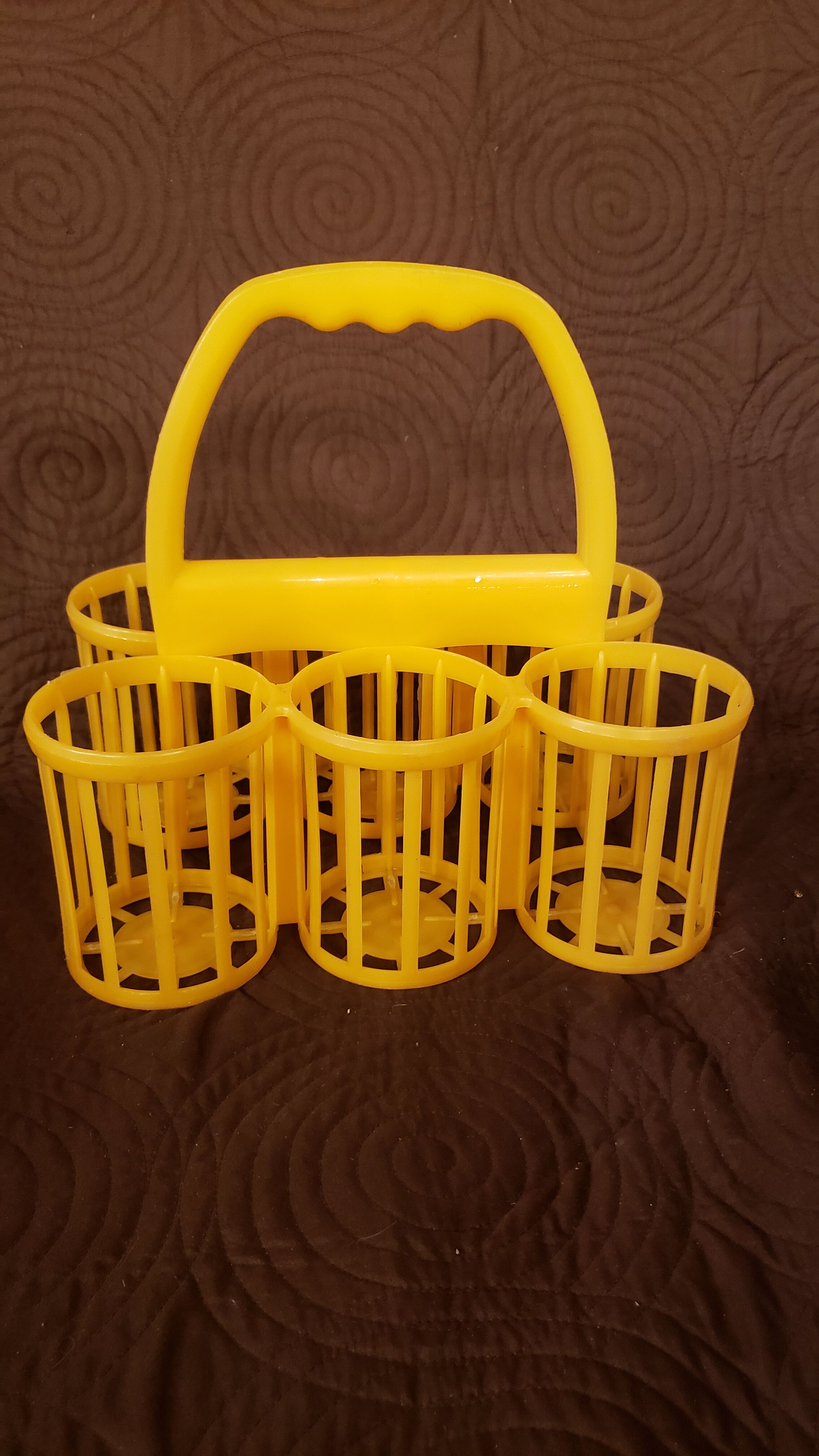 Vintage yellow plastic bottle holder
