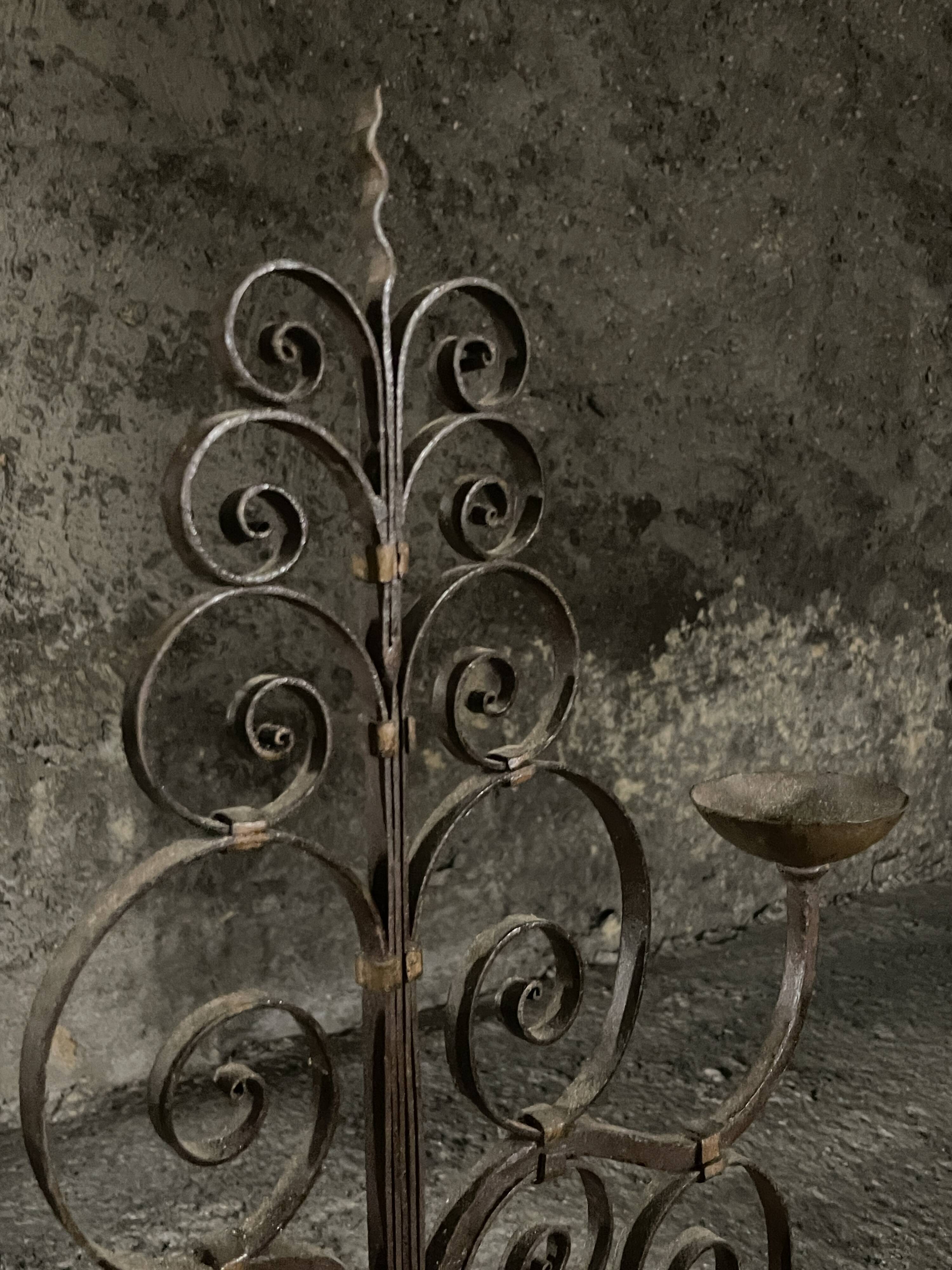 Pair of French wrought iron candelabra from the 19th century.