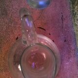 Carafe has décor engraved with foliage