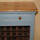 Vintage wooden furniture for 45 wine bottles with a drawer.