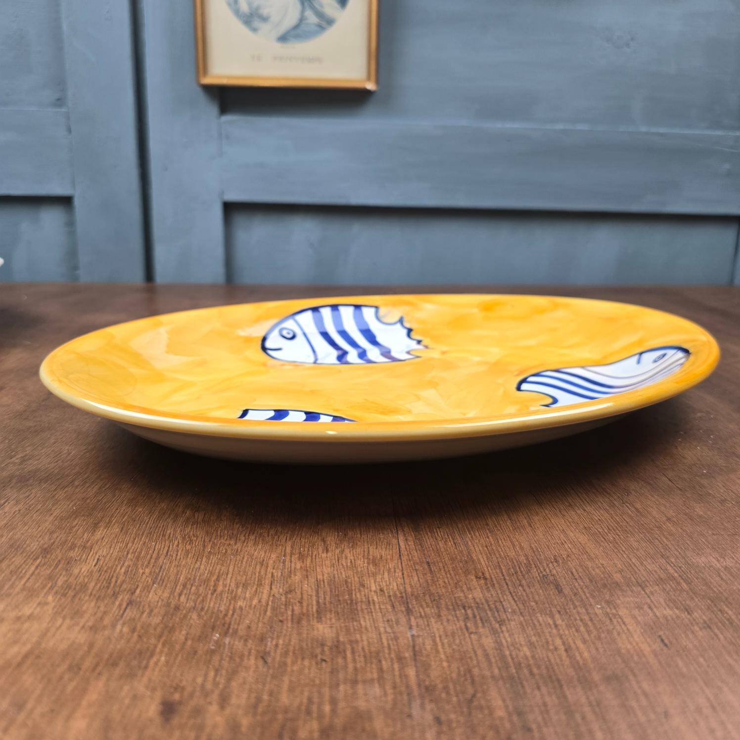 Oval dish decorated with hand-painted blue fish, Mediterranean style
