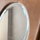 Bevelled oval mirror on oak frame