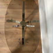 Table moderniste chrome et verre fumé piétement tulipe années 70