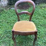 Old wooden chair with upholstered seat