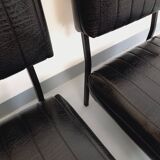 Set of 2 vintage modernist armchairs in black faux leather and metal.