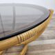Table basse ronde vintage en bambou et verre fumé