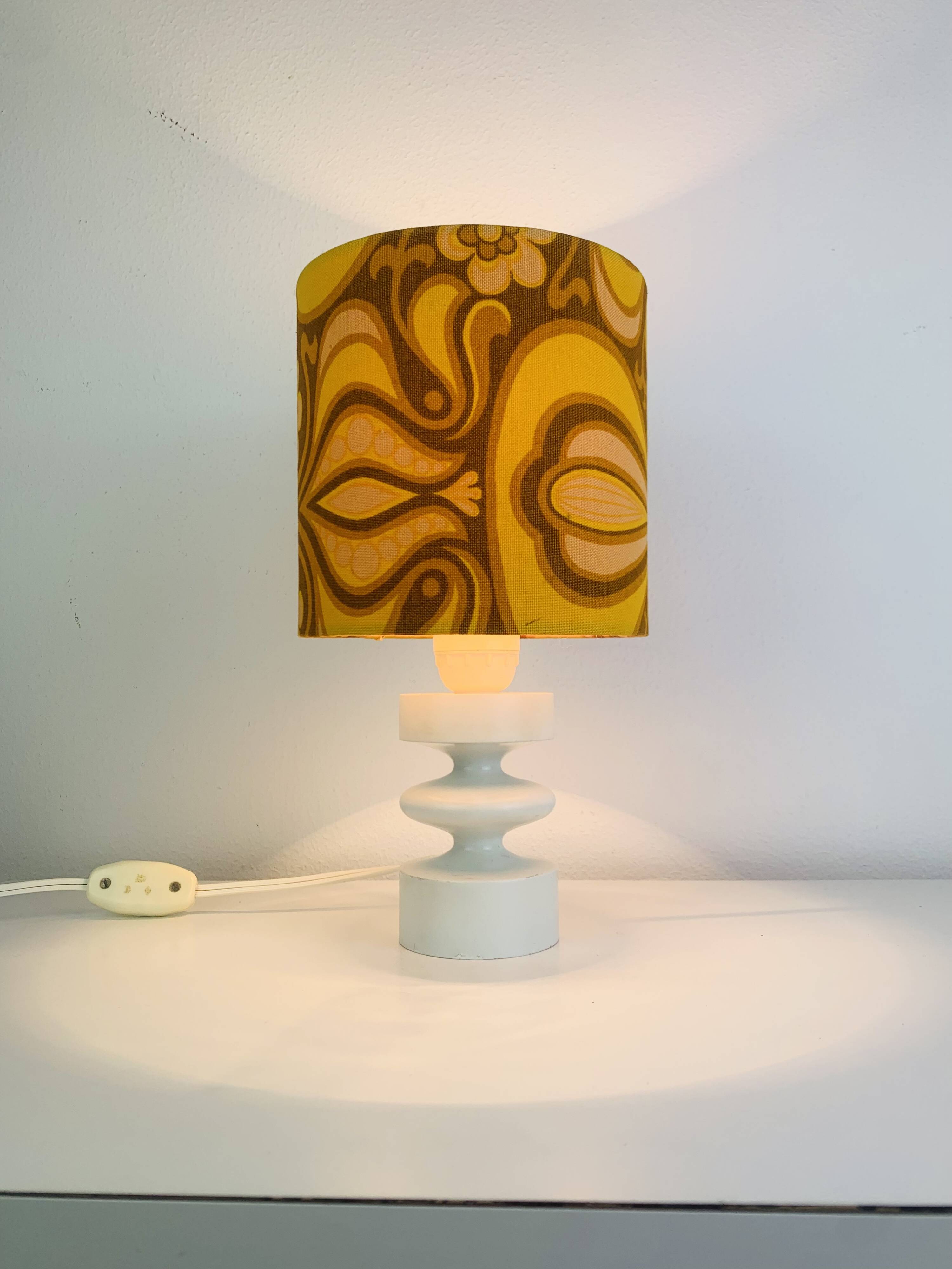 Temde lamp with turned wood and a seventies lampshade.