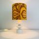 Temde lamp with turned wood and a seventies lampshade.