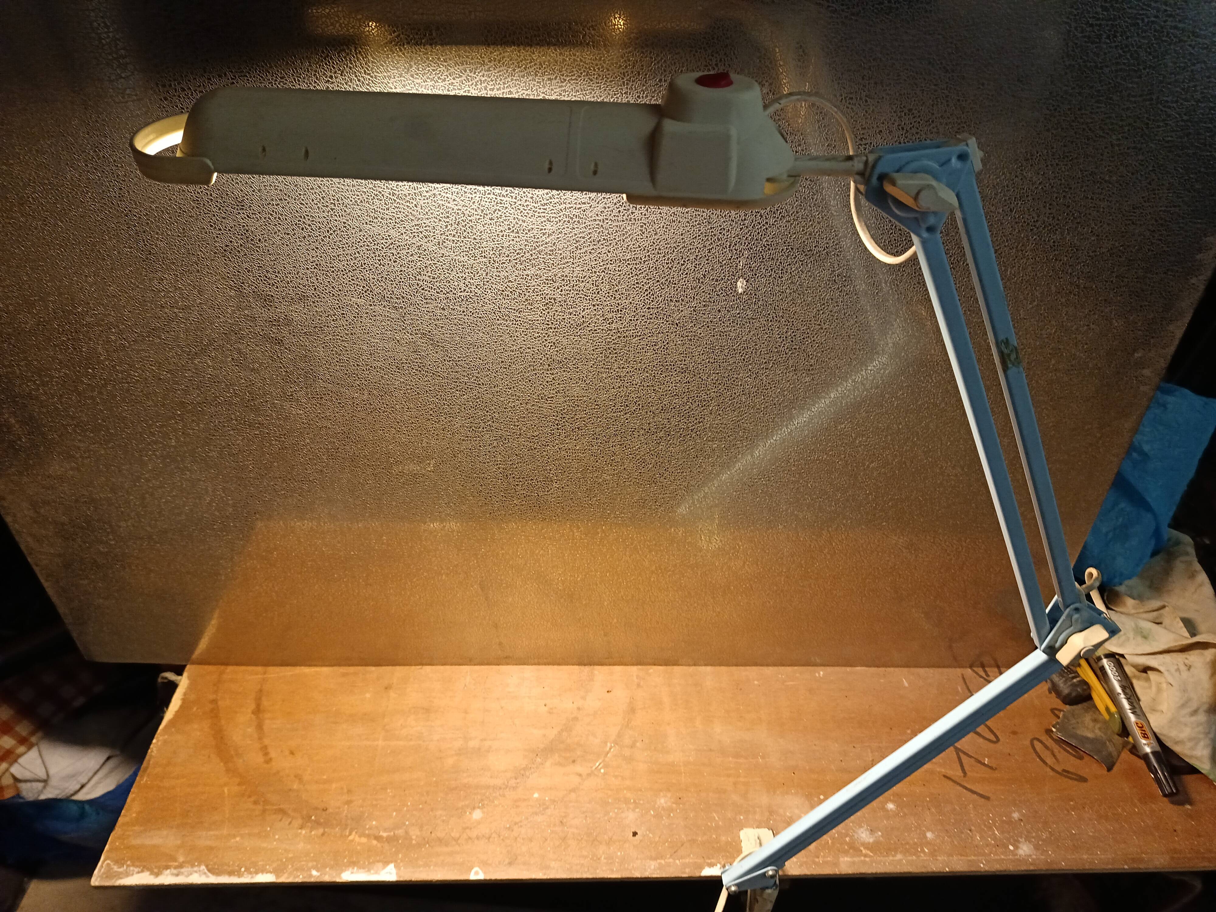 Articulated blue desk lamp