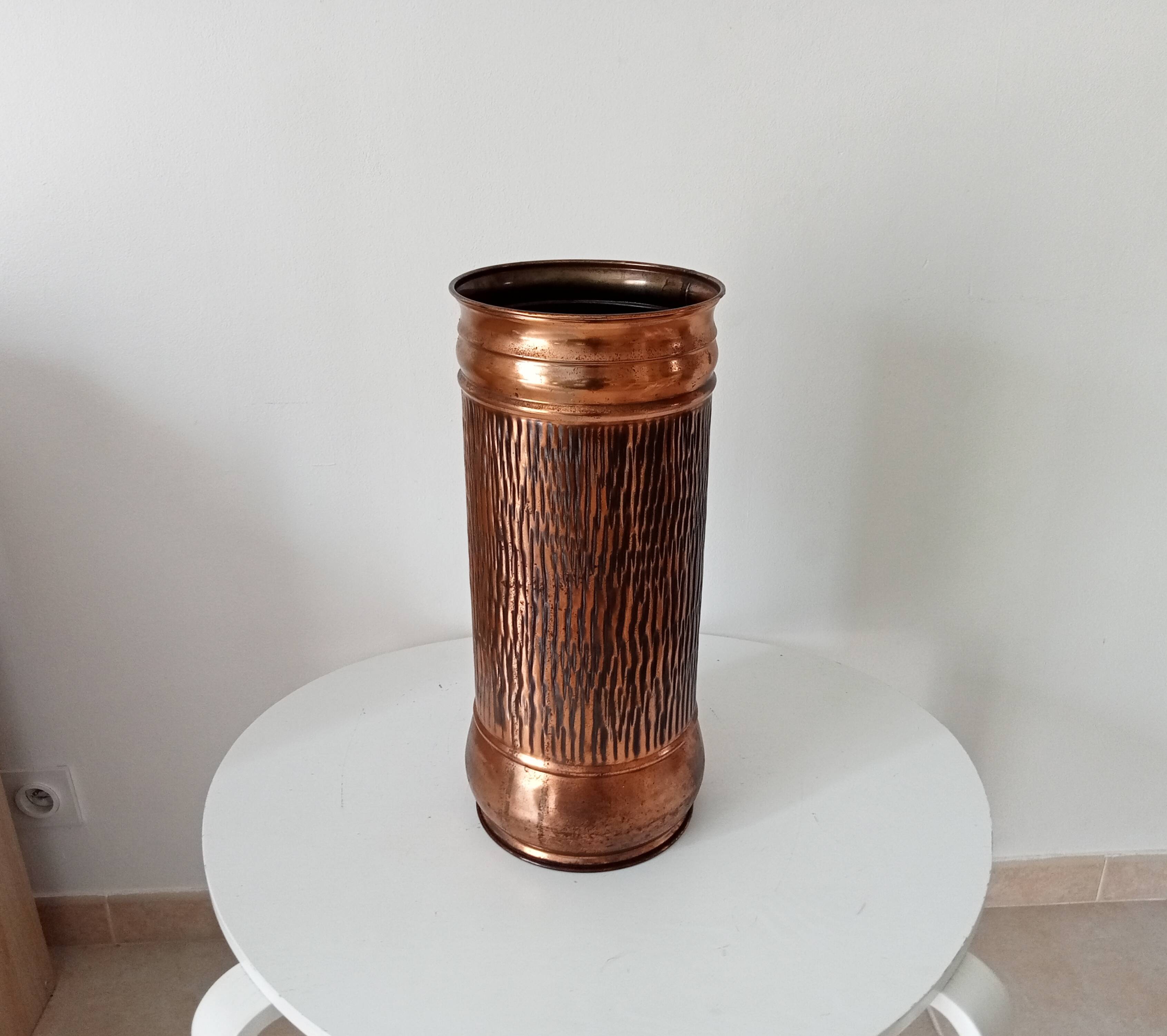 Vintage brutalist umbrella stand in hammered copper with a wood effect.