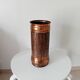 Vintage brutalist umbrella stand in hammered copper with a wood effect.