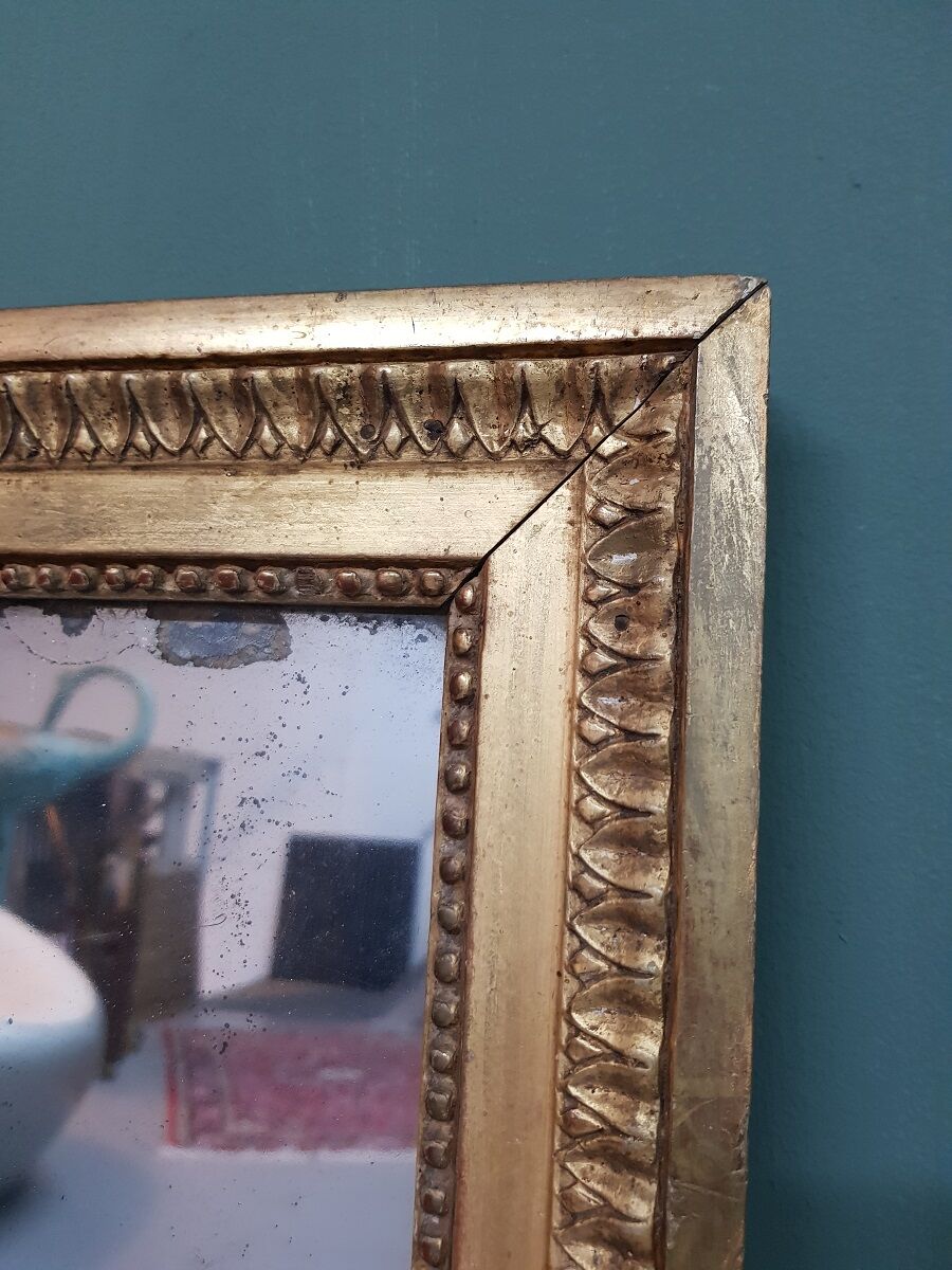 Antique french gilded Louis XVl mirror with mercury glass