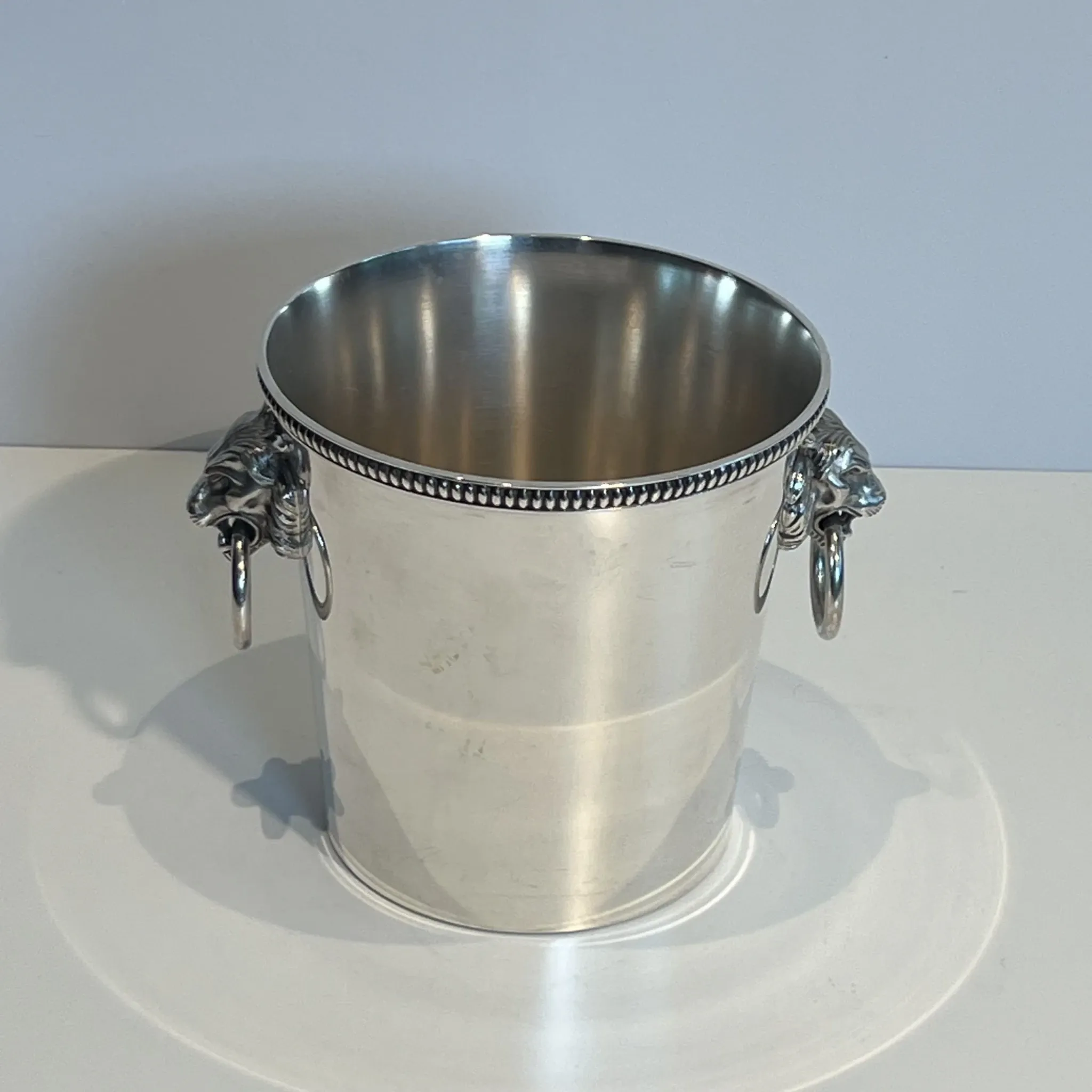 Silver-plated champagne bucket Orfèvrerie Saint-Médard. Handles in the shape of heads.