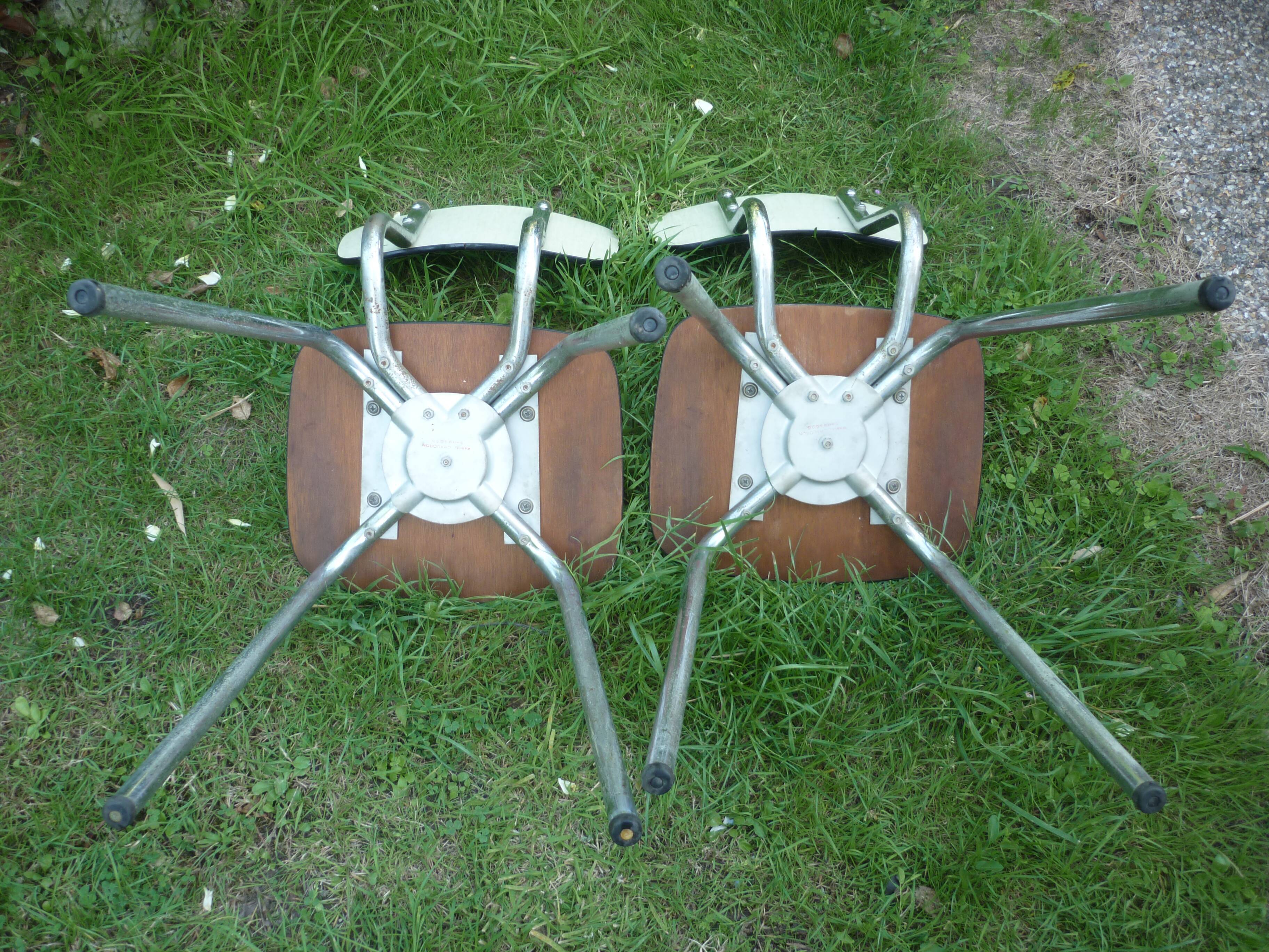 Pair of pale yellow formica chairs