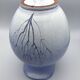 Blue glazed terracotta pitcher with hand-painted decoration, signed